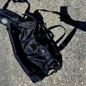 I have a black Gucci duffle bag. perfect carry on luggage bag